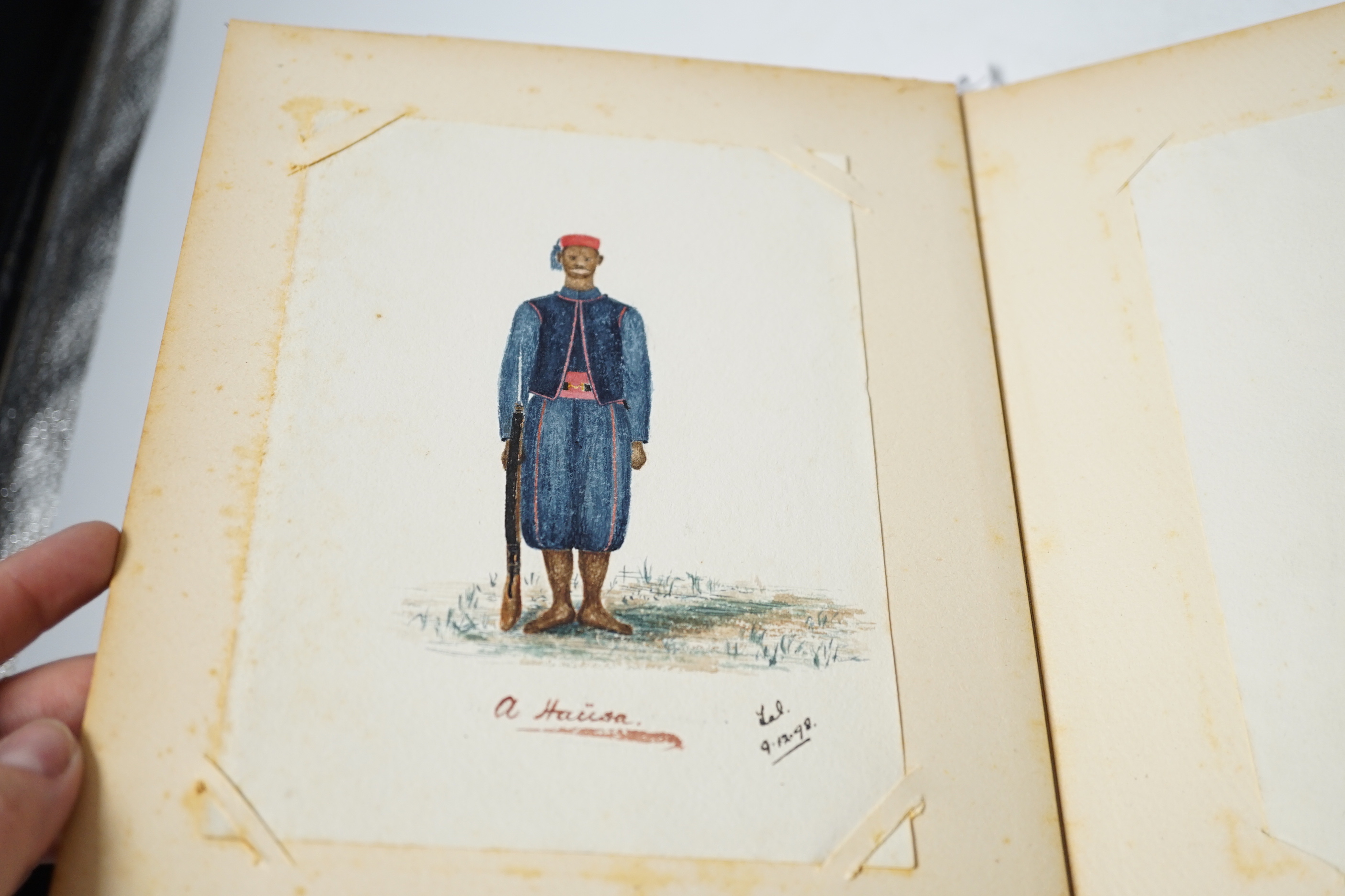 A quantity Nigerian sketches and photographs housed in an album